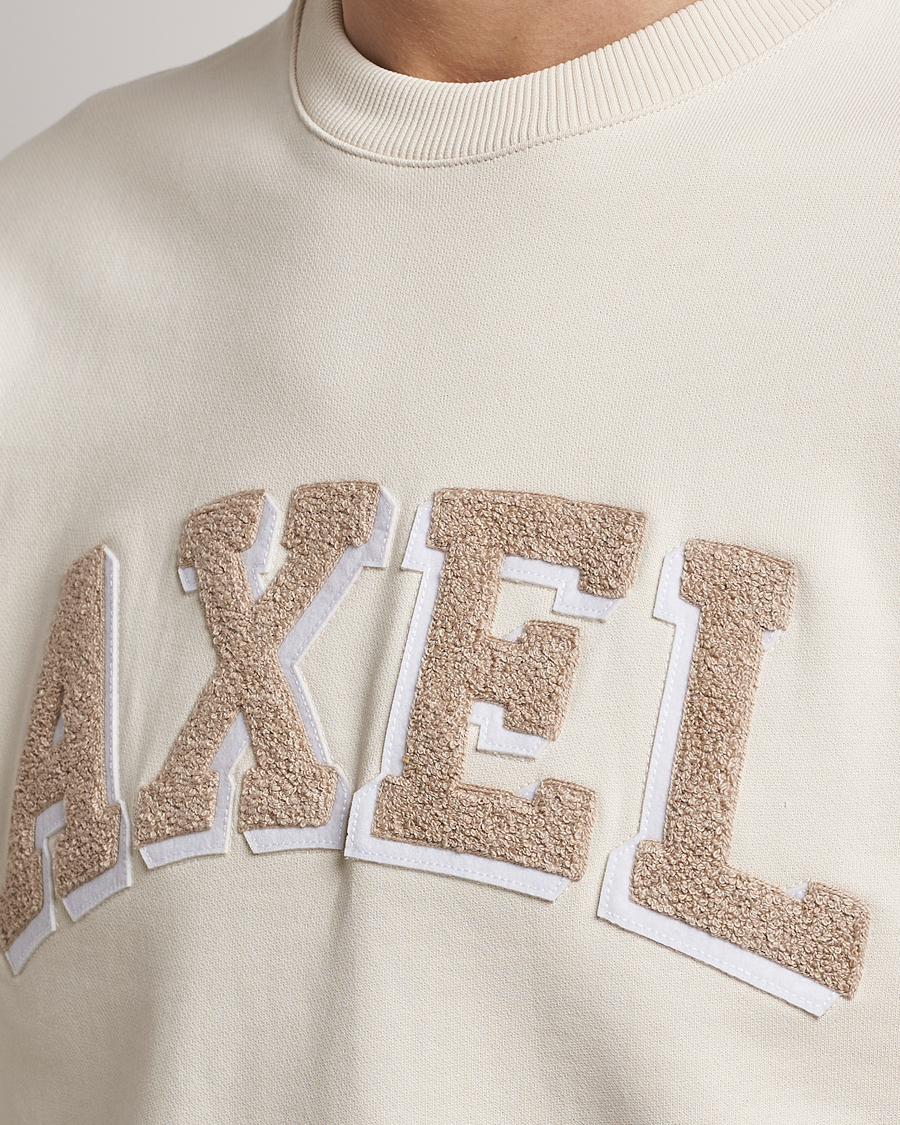 Uomini | Maglieria | Axel Arigato | Axel Arc Sweatshirt Pale Beige