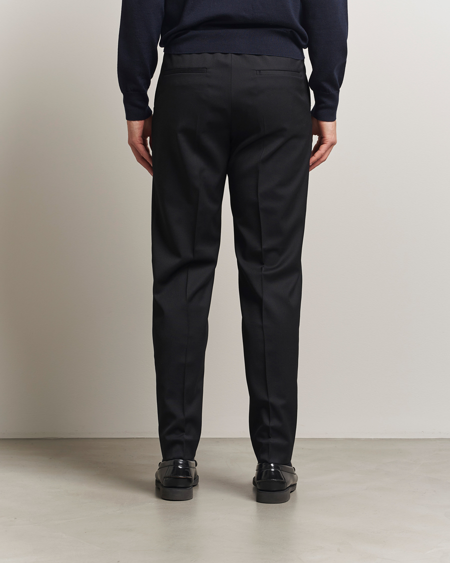 Uomini | Pantaloni | Filippa K | Relaxed Terry Wool Trousers Black
