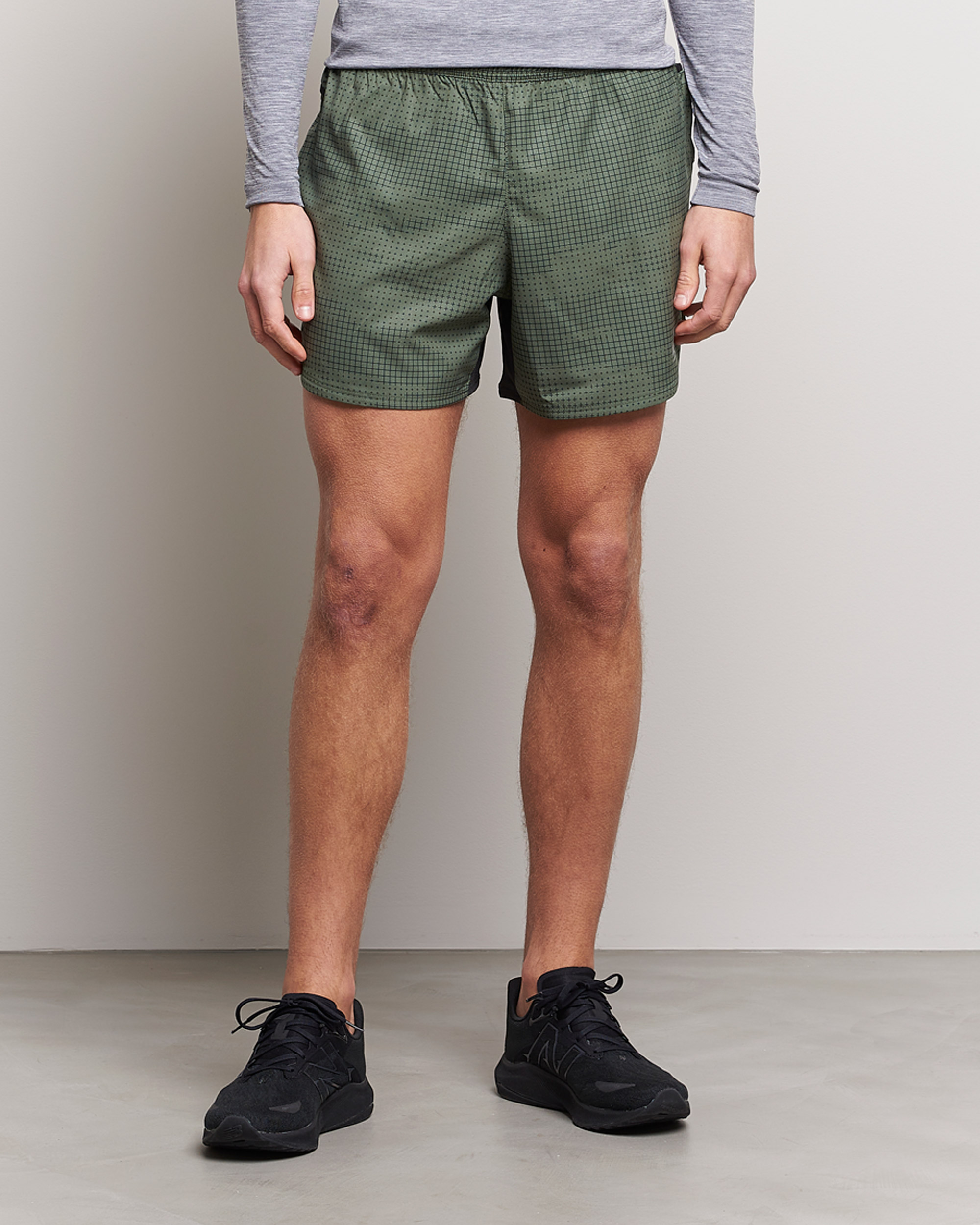 Uomini | Pantaloncini | New Balance Running | Impact Run 5 Inch Shorts Deep Olive