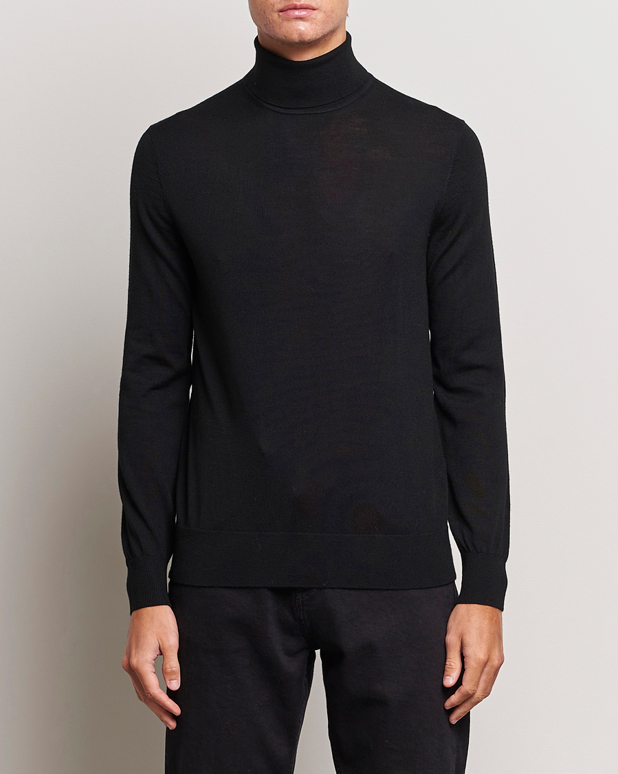 Uomini | Maglieria | Tiger of Sweden | Nevile Extra Fine Merino Polo Black
