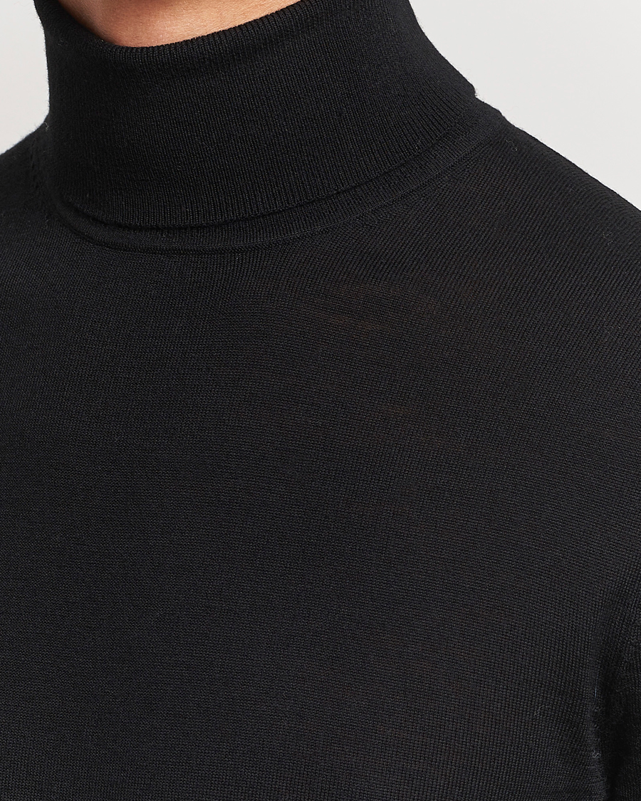 Uomini | Maglieria | Tiger of Sweden | Nevile Extra Fine Merino Polo Black