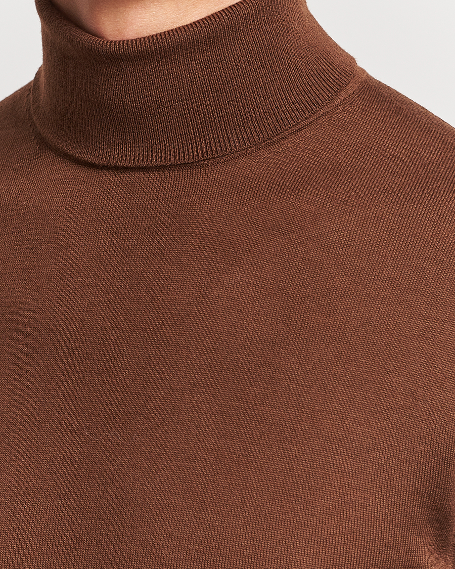 Uomini | Maglieria | Tiger of Sweden | Nevile Extra Fine Merino Polo Golden Copper