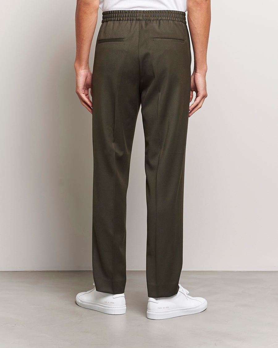Uomini | Pantaloni | Filippa K | Relaxed Terry Wool Trousers Dark Forest Green