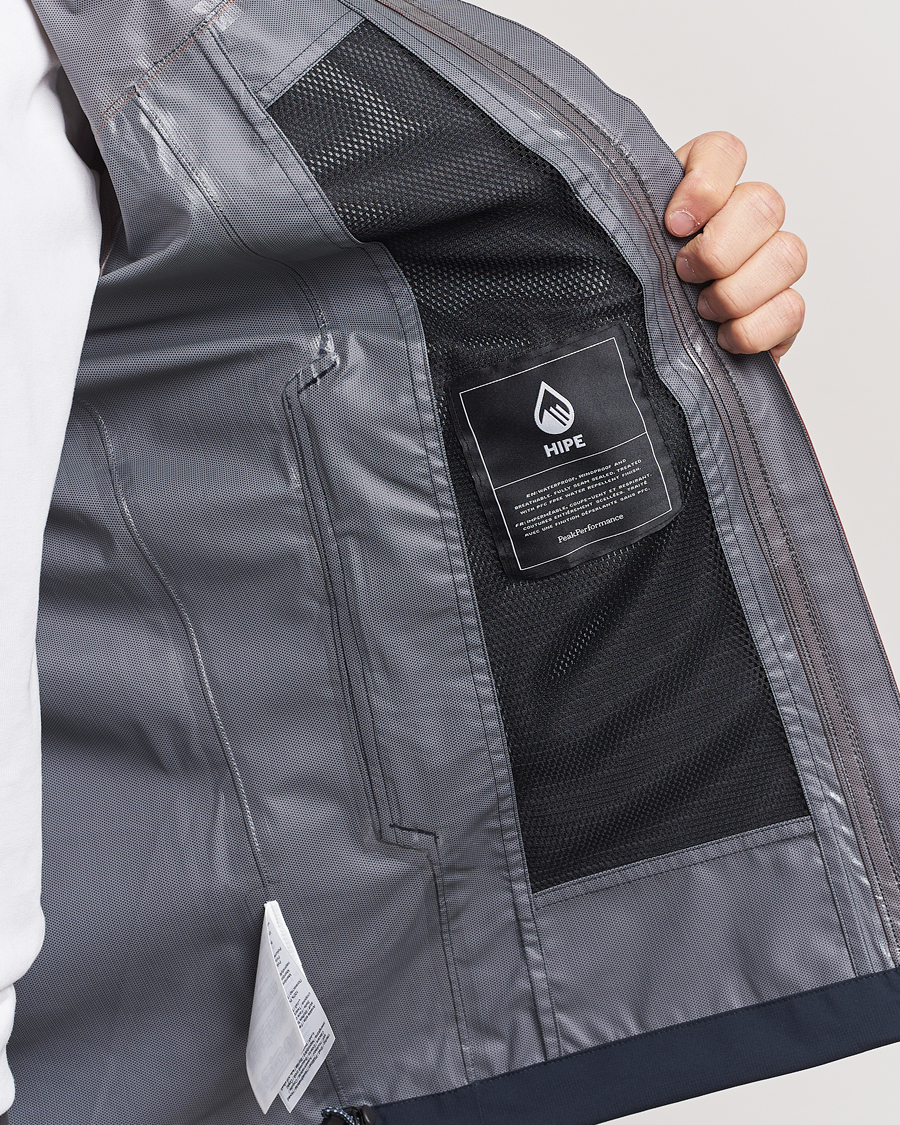 Uomini | Giacche | Peak Performance | Trail Hipe Hooded Jacket Spiced/Salute Navy/Desert
