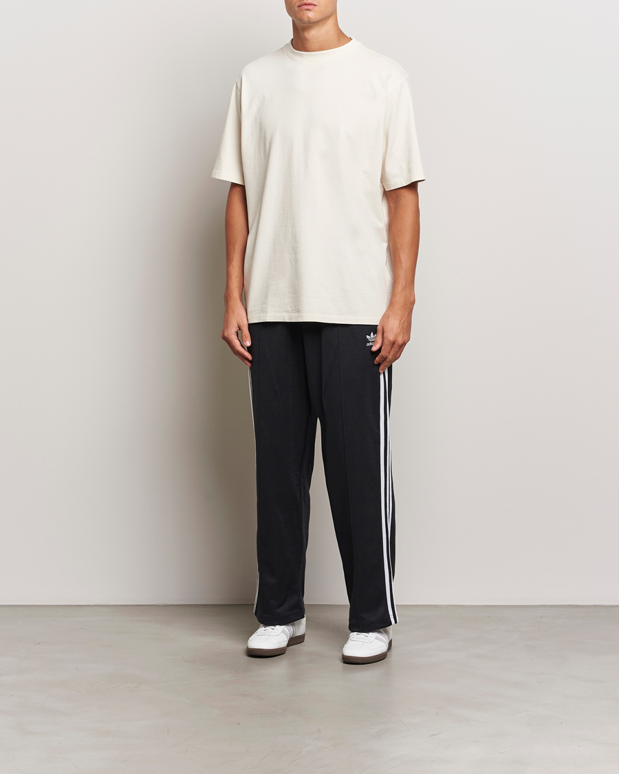 Uomini | Pantaloni | adidas Originals | Firebird Baggy Pant Black