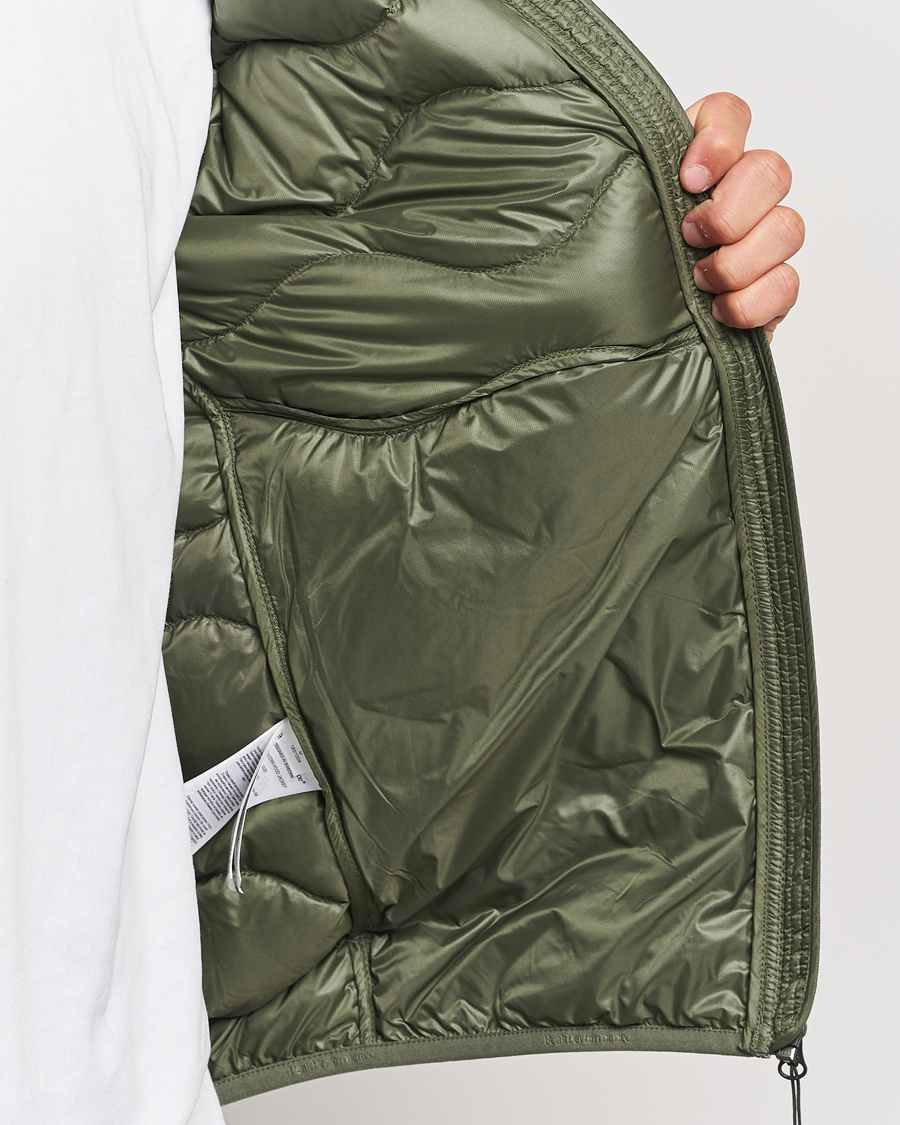 Uomini | Giacche | Peak Performance | Helium Down Hooded Jacket Pine Needle