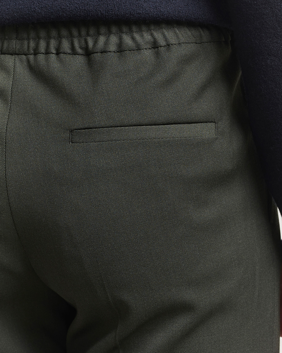 Uomini | Pantaloni | Filippa K | Theo Relaxed Wool Trousers Green Melange