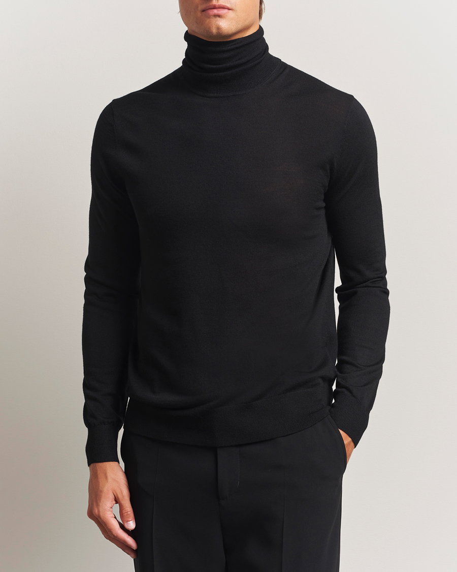 Uomini | Maglieria | Tiger of Sweden | Nevile Extra Fine Merino Polo Black