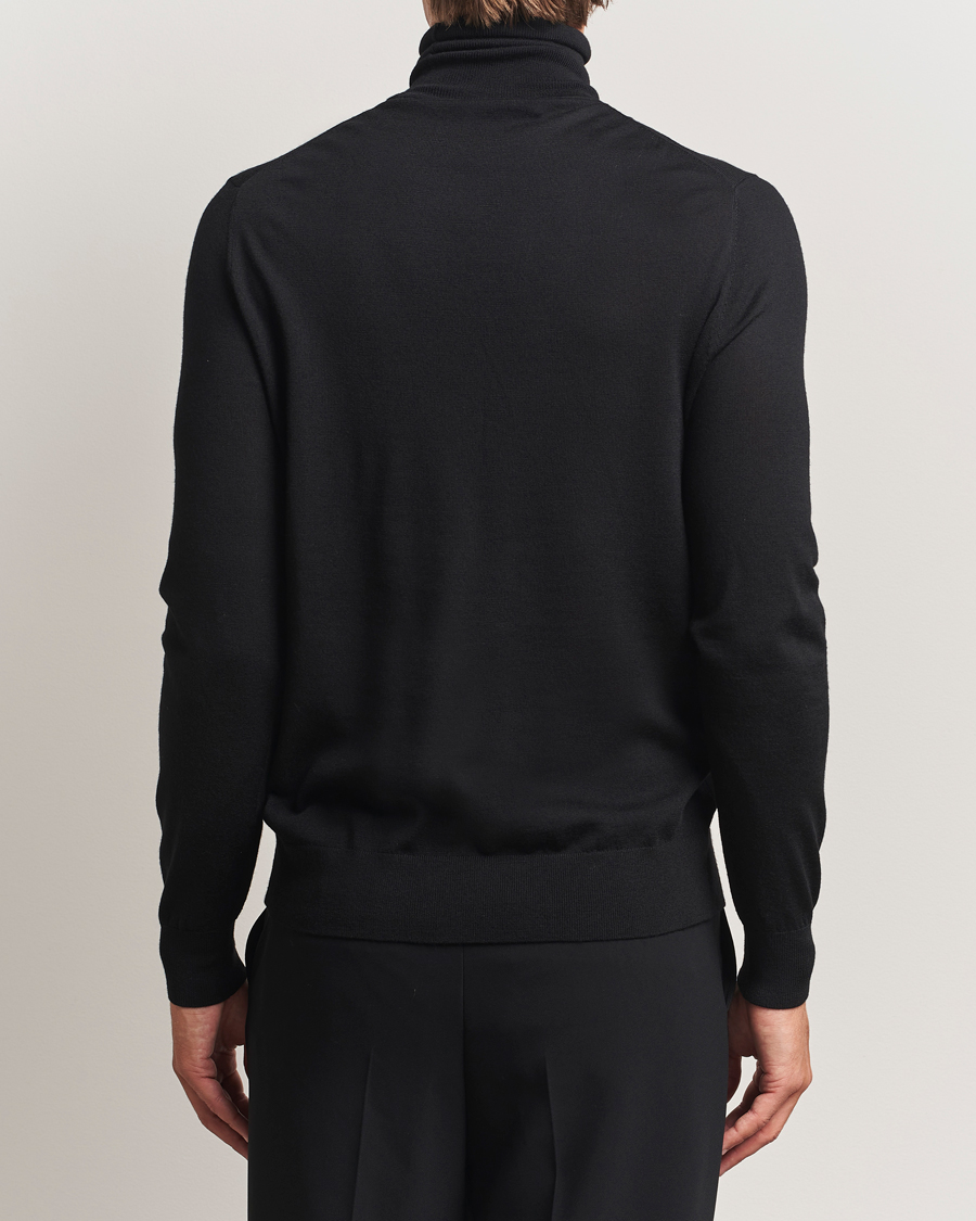 Uomini | Maglieria | Tiger of Sweden | Nevile Extra Fine Merino Polo Black