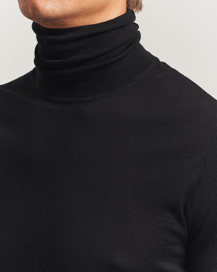 Uomini | Maglieria | Tiger of Sweden | Nevile Extra Fine Merino Polo Black
