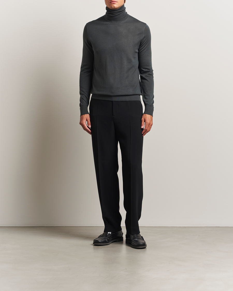 Uomini | Maglieria | Tiger of Sweden | Nevile Extra Fine Merino Polo Midnight Green