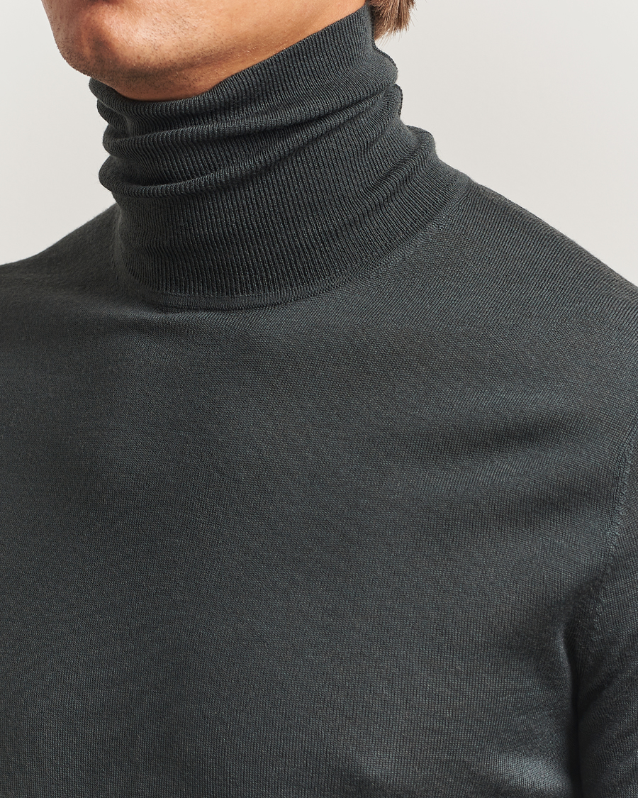 Uomini | Maglieria | Tiger of Sweden | Nevile Extra Fine Merino Polo Midnight Green