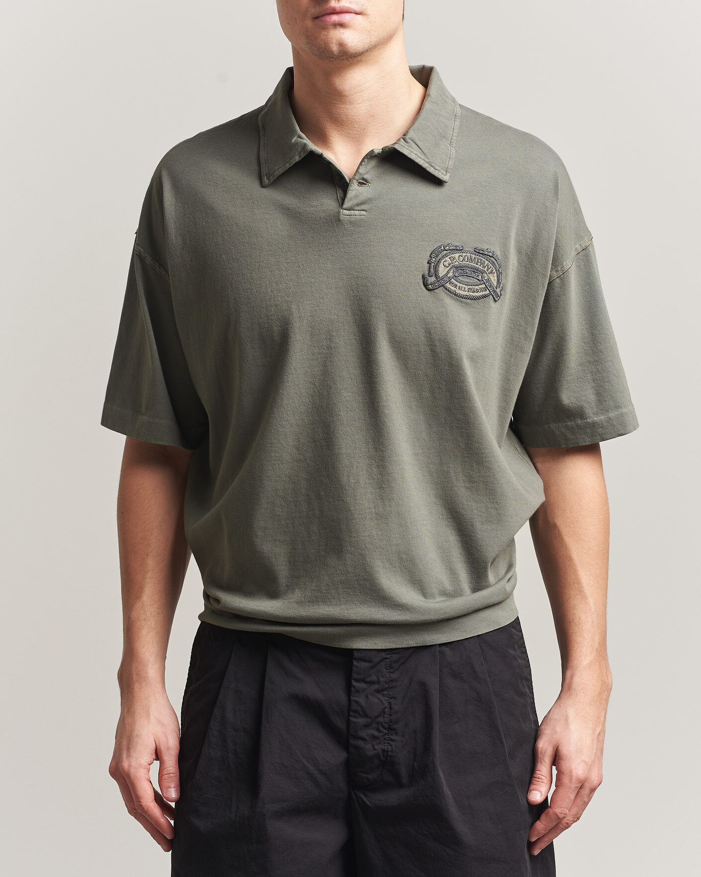 Uomini | Polo | C.P. Company | Boxy Fit Cotton Logo Polo Dark Green