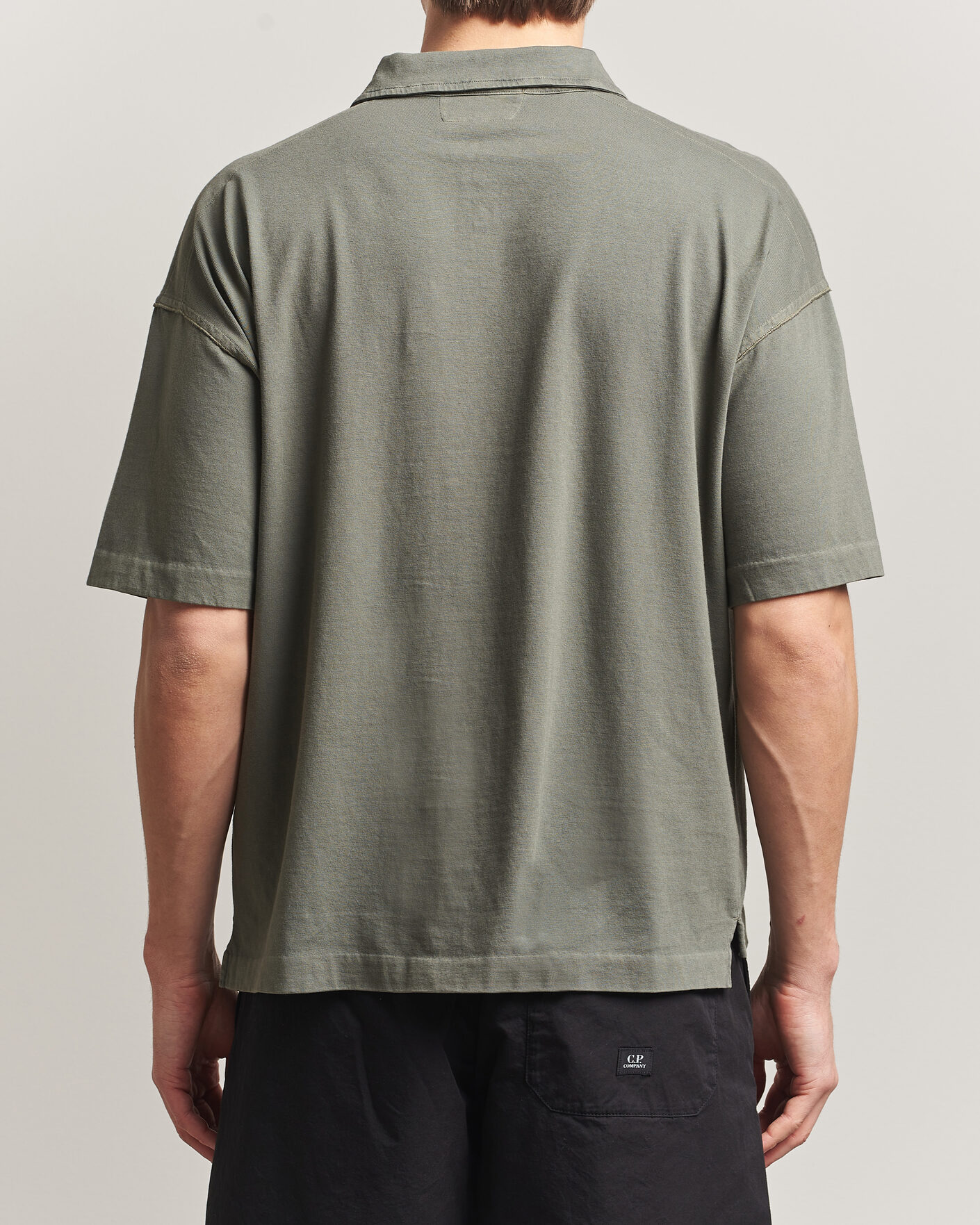 Uomini | Polo | C.P. Company | Boxy Fit Cotton Logo Polo Dark Green