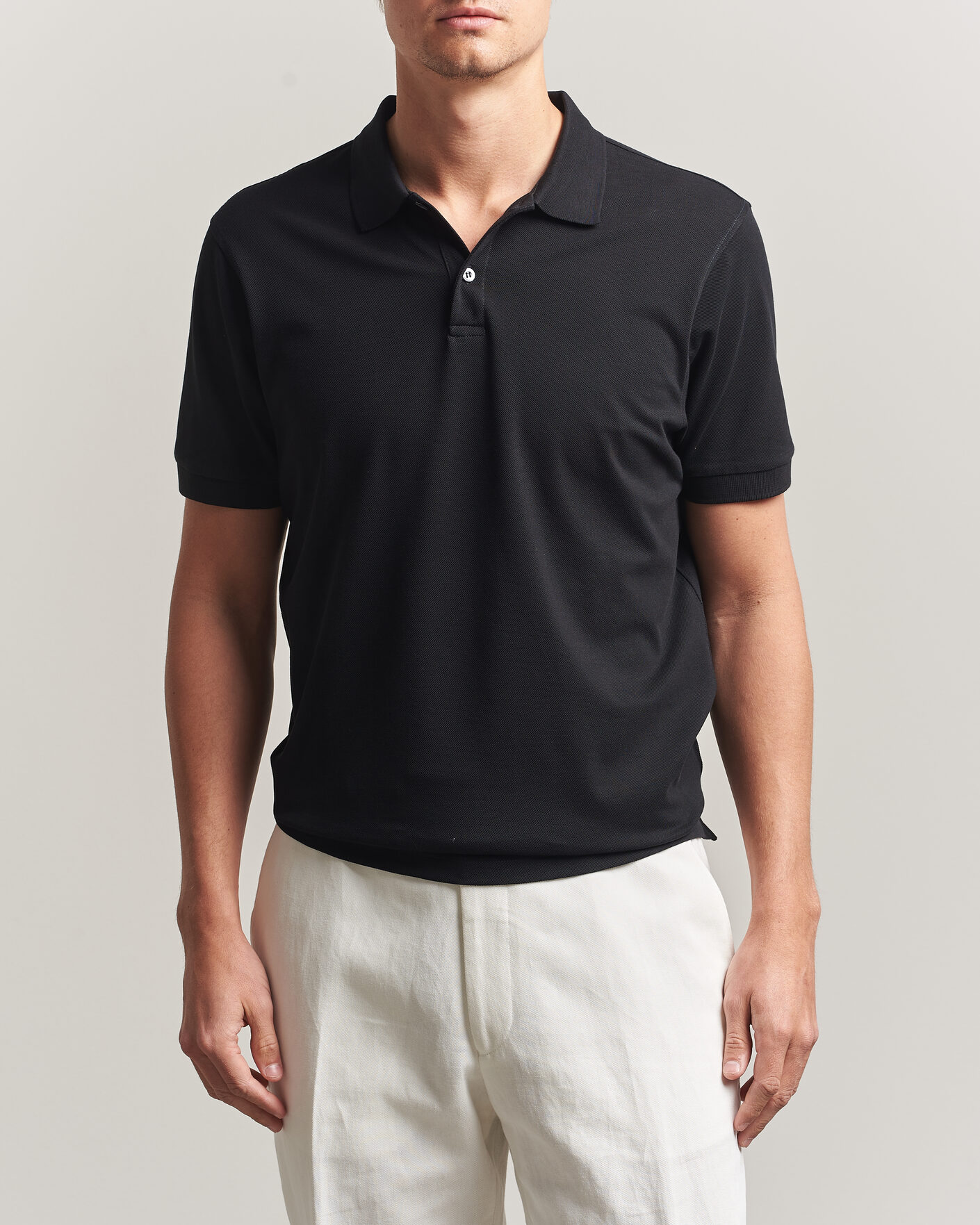 Uomini | Polo | Sunspel | Short Sleeve Pique Polo Black
