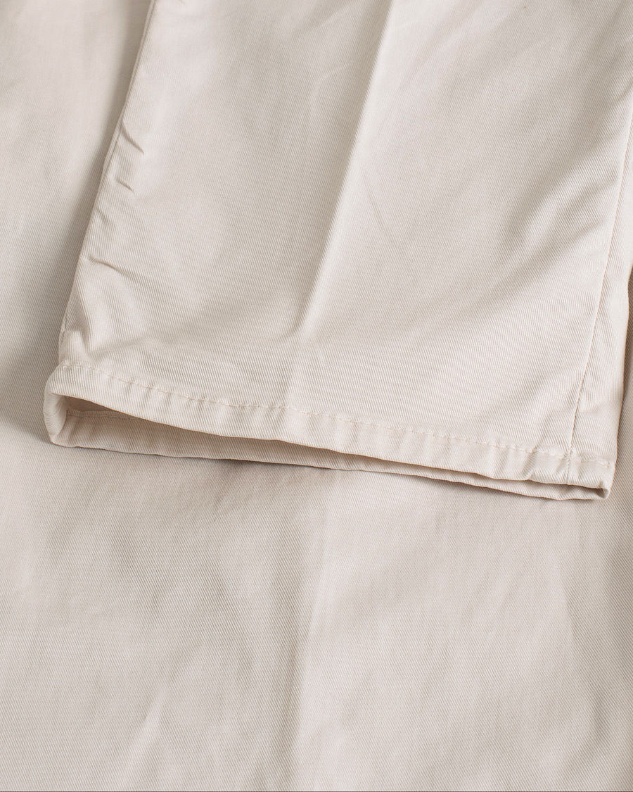 Uomini | Pantaloni | Pre-owned | Brunello Cucinelli Slim Fit Pleated Trousers Off White
